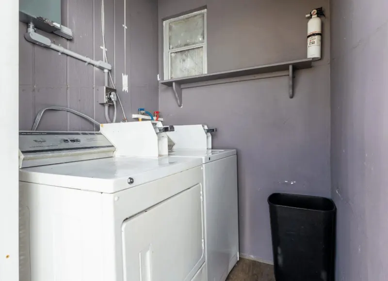 Guest laundry room with washer and dryer