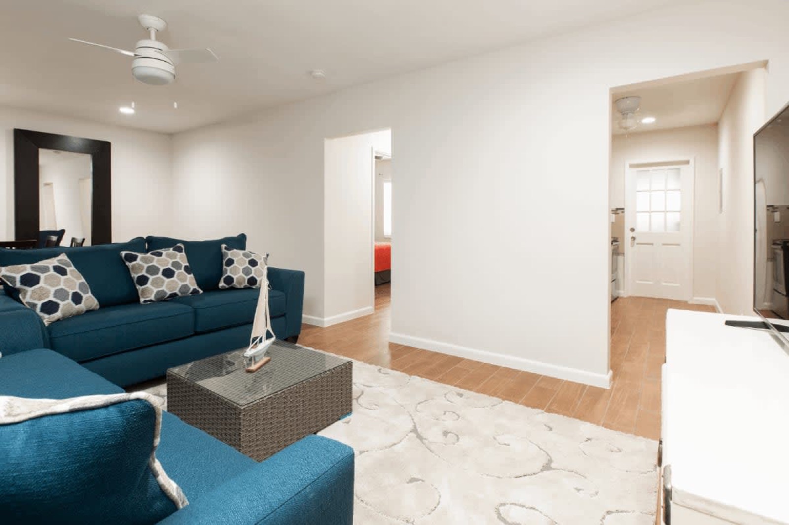 Large living room with sectional sofa at Pompano Breeze, Pompano Beach