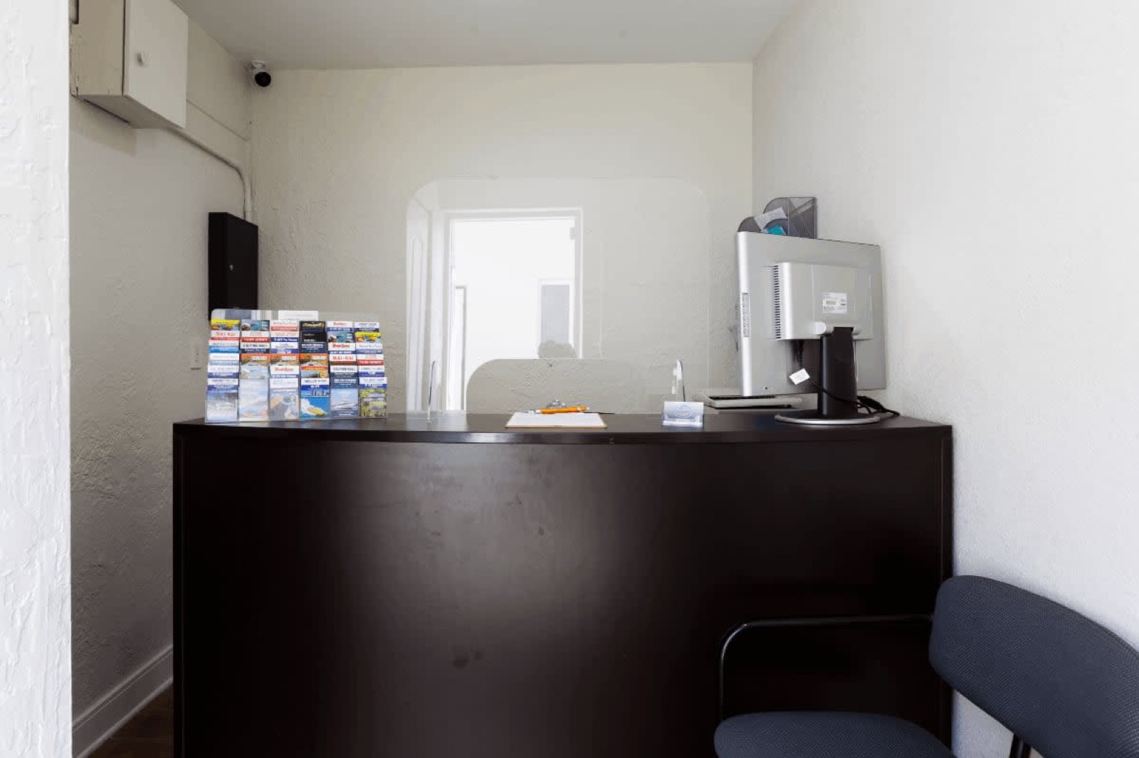 Front office desk with brochure rack at Pompano Breeze, Pompano Beach