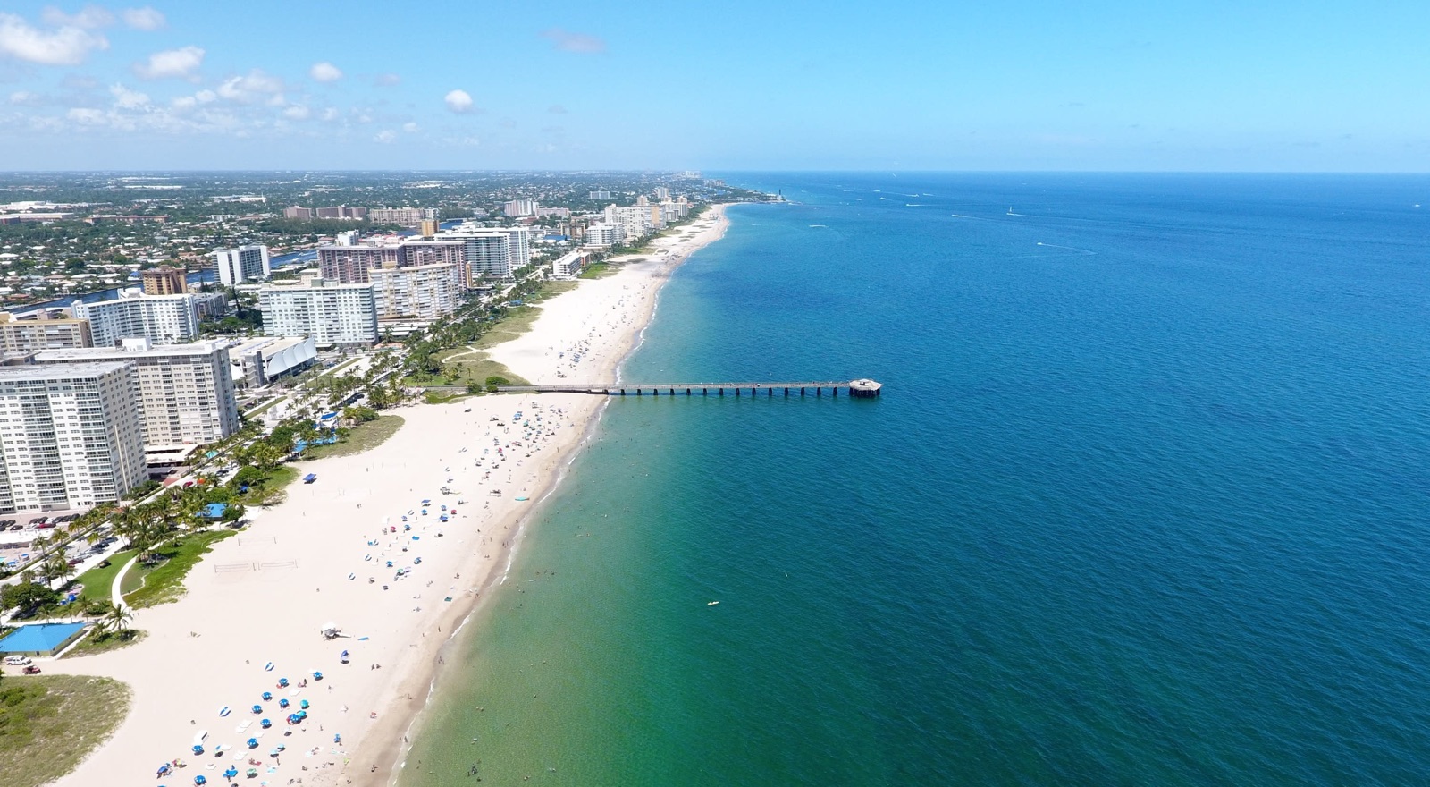 High aerial of coastline, condos and pier, Pompano Beach, FL